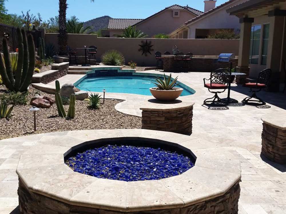 Custom Stone Fire Pit with Blue Glass